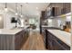 A kitchen with stainless steel appliances, plenty of counter space, and view to the living room at 4184 Kalamath St, Denver, CO 80211