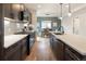 A kitchen with stainless steel appliances, plenty of counter space, and view to the dining room at 4184 Kalamath St, Denver, CO 80211