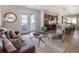 A cozy living room featuring modern furniture, a decorative rug, and french doors leading to an outdoor balcony at 4184 Kalamath St, Denver, CO 80211