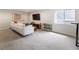 Cozy living room with a white sofa, large window, and neutral decor at 4184 Kalamath St, Denver, CO 80211