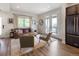 A bright living room featuring comfortable seating, natural light, and access to an outdoor balcony at 4184 Kalamath St, Denver, CO 80211