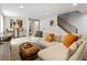 Basement living room with sofa, ottoman, desk, and bar table at 4184 Kalamath St, Denver, CO 80211