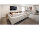 Spacious basement living room features a sofa, tv, and bar table at 4184 Kalamath St, Denver, CO 80211