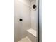 Modern shower with gray tile, a built-in bench, and sleek black fixtures, creating a stylish space at 4184 Kalamath St, Denver, CO 80211