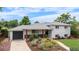Charming two-story home with a well-maintained yard and a beautiful flower bed at 2075 Oakland St, Aurora, CO 80010
