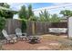 Landscaped backyard with a fire pit and comfortable seating for outdoor entertainment at 2075 Oakland St, Aurora, CO 80010