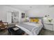 Bedroom showcasing a comfortable bed, stylish decor, and bright lighting fixtures at 2075 Oakland St, Aurora, CO 80010