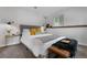 Bedroom showcasing a comfortable bed, stylish decor, and bright lighting fixtures at 2075 Oakland St, Aurora, CO 80010