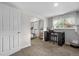 Bedroom featuring desk area with window, and a connecting door to additional spaces, perfect for an office or guest room at 2075 Oakland St, Aurora, CO 80010