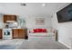 Cozy living area adjacent to the kitchen, featuring a daybed and modern finishes at 2075 Oakland St, Aurora, CO 80010