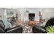 Cozy living room with hardwood floors, stylish rug, modern furniture, and plenty of natural light at 2075 Oakland St, Aurora, CO 80010
