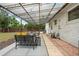 Outdoor patio with a covering, string lights, and plenty of seating for relaxation at 2075 Oakland St, Aurora, CO 80010