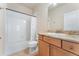 Full bathroom featuring a granite countertop, wood vanity, and a shower-tub combo for all your bathing needs at 9099 Prairie Sky Ln, Lone Tree, CO 80124