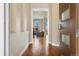 Bright and open foyer with gleaming hardwood floors and a glimpse into the living area beyond at 9099 Prairie Sky Ln, Lone Tree, CO 80124