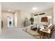 Spacious living room featuring neutral paint and carpet and ample natural light at 9099 Prairie Sky Ln, Lone Tree, CO 80124