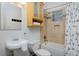 Functional bathroom featuring a tub/shower combo and built-in storage at 2527 W Dunkeld Pl, Denver, CO 80211