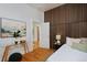 Bedroom showcasing a striking accent wall and stylish decor elements at 2527 W Dunkeld Pl, Denver, CO 80211
