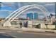 View of a modern white bridge with a pedestrian walkway over a street with tall blue buildings in the background at 2527 W Dunkeld Pl, Denver, CO 80211