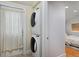 Laundry area featuring a stacked washer and dryer set at 2527 W Dunkeld Pl, Denver, CO 80211