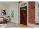 Close up of a front door and entry area showcasing hardwood floors and modern design at 2527 W Dunkeld Pl, Denver, CO 80211