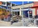 Inviting outdoor seating area at a cafe, complete with tables, chairs, and lush planters near building at 2527 W Dunkeld Pl, Denver, CO 80211
