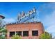 Exterior shot of a brick building with a rooftop restaurant featuring the 'Olinger Mortuaries' sign at 2527 W Dunkeld Pl, Denver, CO 80211