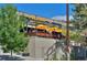 Outdoor patio with seating and yellow umbrellas; a charming restaurant exterior at 2527 W Dunkeld Pl, Denver, CO 80211