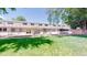 Backyard with lawn, patio, and mature trees at 4940 E Donald Ave # 8, Denver, CO 80222