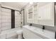 Stylish bathroom with dual sinks, a sleek vanity, and a shower-tub combo at 4940 E Donald Ave # 8, Denver, CO 80222