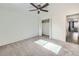 Sun-filled carpeted bedroom features a ceiling fan and closet at 4940 E Donald Ave # 8, Denver, CO 80222