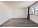 Bright, airy bedroom with hardwood floors and large window at 4940 E Donald Ave # 8, Denver, CO 80222