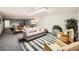 Spacious common room featuring a sofa, chairs, tables, and recreation area at 4940 E Donald Ave # 8, Denver, CO 80222