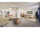 Bright living room featuring hardwood floors, neutral paint, and an open floor plan at 4940 E Donald Ave # 8, Denver, CO 80222