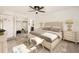 Bright main bedroom featuring a large bed, neutral tones, and a walk-in closet at 4940 E Donald Ave # 8, Denver, CO 80222