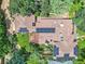 Stunning aerial view of the home showcasing the roof's solar panels and the lush greenery surrounding the property at 3135 11Th St, Boulder, CO 80304