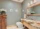 Stylish powder room featuring granite countertop vanity and decorative mirror with neutral paint at 3135 11Th St, Boulder, CO 80304