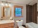 Modern bathroom featuring a granite vanity, tiled walls, and a luxurious shower and bath at 3135 11Th St, Boulder, CO 80304