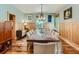 Elegant dining room with wood paneled walls, custom lighting, and a large rustic table at 3135 11Th St, Boulder, CO 80304