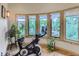 Bright exercise room with a wall of windows bringing natural light and views of the landscape at 3135 11Th St, Boulder, CO 80304