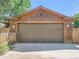 A detached garage with natural wood accents, and a concrete driveway at 3135 11Th St, Boulder, CO 80304