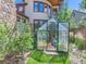 Backyard greenhouse nestled amongst mature landscaping at 3135 11Th St, Boulder, CO 80304