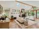 Bright living room with skylights, a stone fireplace, and hardwood floors at 3135 11Th St, Boulder, CO 80304