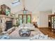 Inviting living room featuring a stone fireplace, hardwood floors and French doors at 3135 11Th St, Boulder, CO 80304