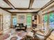 Inviting living room with exposed beam ceiling, hardwood floors, and comfortable seating with natural light at 3135 11Th St, Boulder, CO 80304