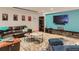 Comfortable living room with a leather sofa, colorful decor, and a large wall-mounted TV at 3135 11Th St, Boulder, CO 80304