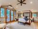 Elegant main bedroom with a four-poster bed, hardwood floors, and a private balcony entrance at 3135 11Th St, Boulder, CO 80304