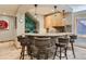 A stylish wet bar with stone accents, modern lighting, and seating at 3135 11Th St, Boulder, CO 80304