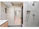 Clean basement bathroom with a walk-in shower at 2325 S High St, Denver, CO 80210