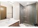 Modern bathroom with a single vanity and large shower at 2325 S High St, Denver, CO 80210