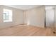 Light-filled bedroom with wood flooring and a window at 2325 S High St, Denver, CO 80210